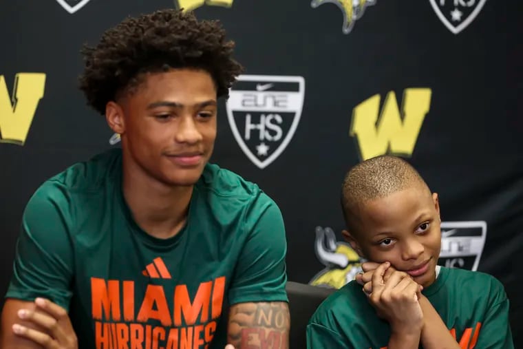Jalil Bethea and his little brother Saleem, 9, after the Archbishop Wood guard announced his commitment to Miami.