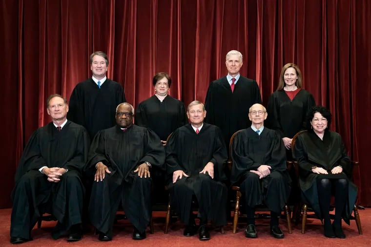 Members of the Supreme Court pose for a group photo at the Supreme Court in Washington, April 23, 2021. Seated from left are Associate Justice Samuel Alito, Associate Justice Clarence Thomas, Chief Justice John Roberts, Associate Justice Stephen Breyer and Associate Justice Sonia Sotomayor, Standing from left are Associate Justice Brett Kavanaugh, Associate Justice Elena Kagan, Associate Justice Neil Gorsuch and Associate Justice Amy Coney Barrett. The Supreme Court has ended constitutional protections for abortion that had been in place nearly 50 years — a decision by its conservative majority to overturn the court's landmark abortion cases. (Erin Schaff/The New York Times via AP, Pool, File)
