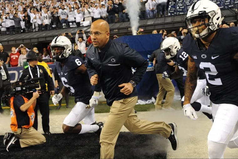 Penn State football coach James Franklin leads his team onto the field prior to the start of the Big Ten Championship Game in Indianapolis December 5, 2016. The Nittany Lions won the championship, beating Wisconsin.