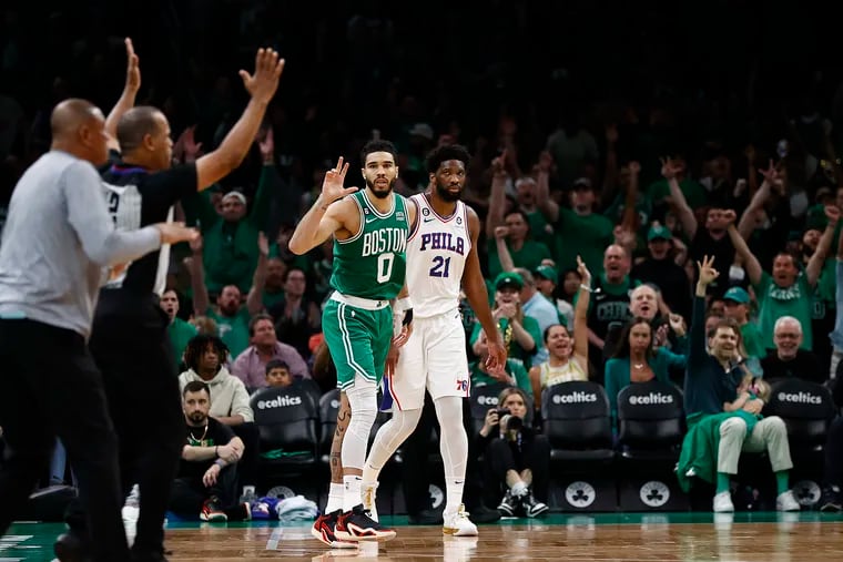 Boston Celtics forward Jayson Tatum reacts after sinking a three-pointer in front of the Sixers’ bench during Game 7 of the Eastern Conference semifinals on May 14.