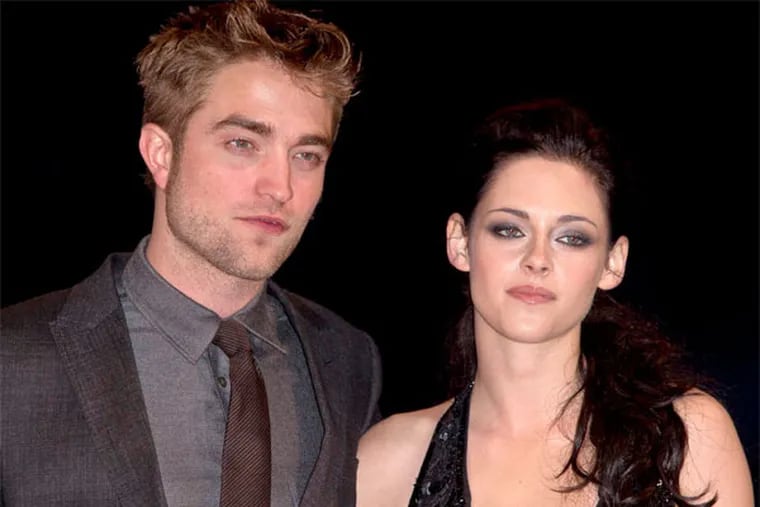 Robert Pattinson and Kristen Stewart are on again and off again after the actress was caught cheating on her boyfriend with director Rupert Sanders last summer. (AP Photo / Joel Ryan)