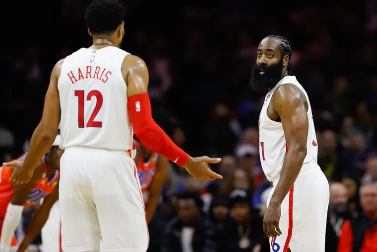 Sixers guard James Harden looks at teammate forward Tobias Harris during a game against the Oklahoma City Thunder on January 12, 2023, in Philadelphia.