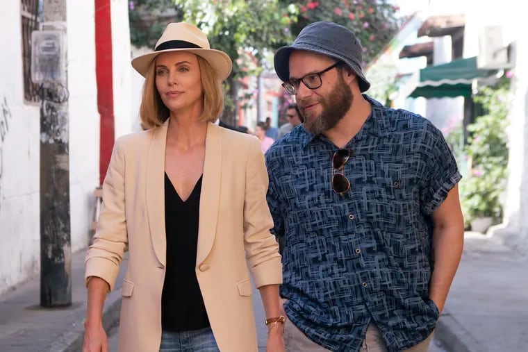 Charlize Theron as Charlotte Fields and Seth Rogen as and Fred Flarsky in the film "Long Shot." (Hector Alvarez/TNS)