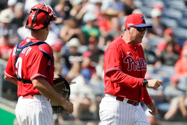 Bryan Price, right, joined Joe Girardi's staff last October. He retired after only one season with the Phillies.