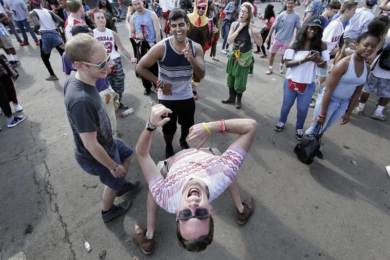Bruce Gondeck dances in the street during the Budweiser Made In America festival on the Ben Franklin Parkway in 2017.