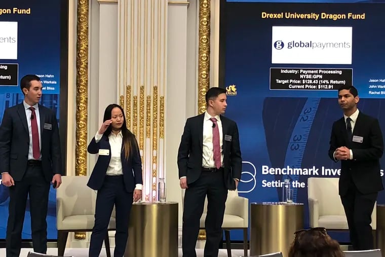 Drexel University MBAs with the Dragon Fund present their best investment ideas at the New York Stock Exchange, Jan. 22, 2019. From left: Maxwell Goldstein, Rachel Bliss, Dean Blank and Soham Mukherjee.