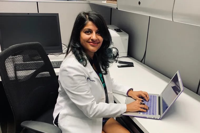 Dr. Aditi Joshi is in self-quarantine after contracting COVID-19, but still seeing patients through Jefferson Health's telemedicine service.