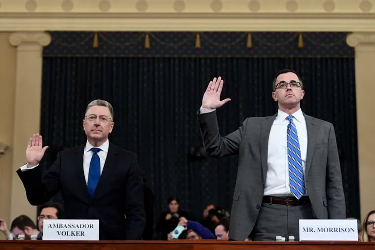 Ambassador Kurt Volker, left, former special envoy to Ukraine, and Tim Morrison, a former official at the National Security Council are sworn in to testify before the House Intelligence Committee on Capitol Hill in Washington, Tuesday, Nov. 19, 2019, during a public impeachment hearing of President Donald Trump's efforts to tie U.S. aid for Ukraine to investigations of his political opponents.
