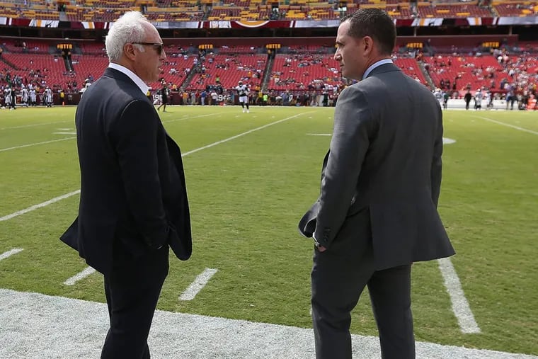 Howie Roseman (right) with Eagles owner Jeffrey Lurie before the win over Washington.