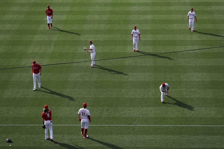 Phillies players warm up before an intrasquad game at Citizens Bank Park in Philadelphia on Thursday, July 16, 2020.