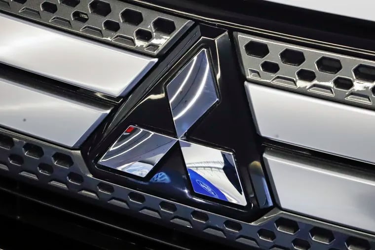 FILE - This Feb. 14, 2019, file photo shows the Mitsubishi logo on the front grill of a 2019 Mitsubishi Outlander GT on display at the 2019 Pittsburgh International Auto Show in Pittsburgh. Mitsubishi Motors on Tuesday, June 25, announced it is relocating its North America headquarters from California to Tennessee, a move that will bring the Japanese automaker closer to its sister company Nissan and strengthen Tennessee's growing reputation as an epicenter of the automotive sector.