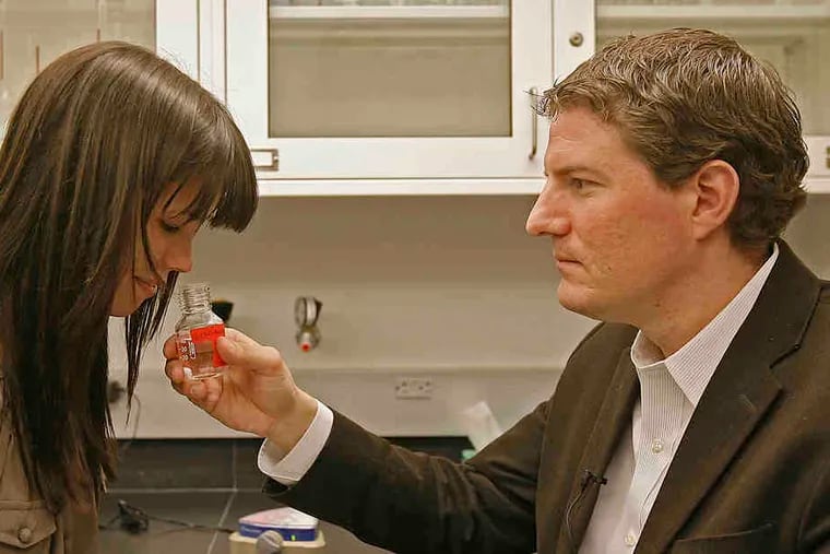 In this file photo, Monell Chemical Senses Center neuroscientist Johan Lundström works with research assistant Eva Alden on a 2018 olfactory study. Now Lundström is looking at smell as an early warning sign of COVID.