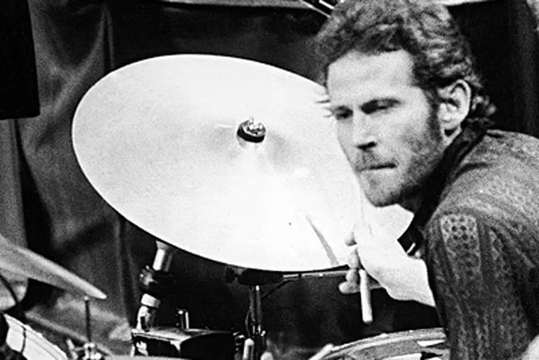 In this Nov. 27, 1976 photo, Levon Helm, of The Band, plays drums at the band's final live performance, at Winterland Auditorium in San Francisco. JOHN STOREY / Associated Press, file