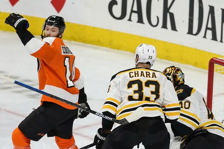 Flyers center Sean Couturier watches his stick float behind him with the Bruins' Zdeno Chara and goalie Tuukka Rask during the second period Tuesday at the Wells Fargo Center.