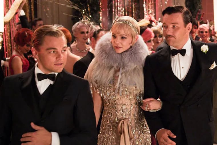 This undated publicity photo released by courtesy Warner From left, Leonardo DiCaprio as Jay Gatsby, Carey Mulligan, as Daisy Buchanan and Joel Edgerton as Tom Buchanan in Warner Bros. Pictures and Village Roadshow Pictures drama, "The Great Gatsby," a Warner Bros. Pictures release. (AP Photo/Warner Bros. Pictures)
