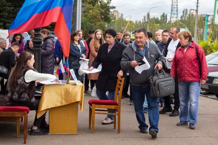 People lining up to vote in a referendum in Luhansk, Luhansk People's Republic, controlled by Russia-backed separatists, eastern Ukraine, on  Saturday.