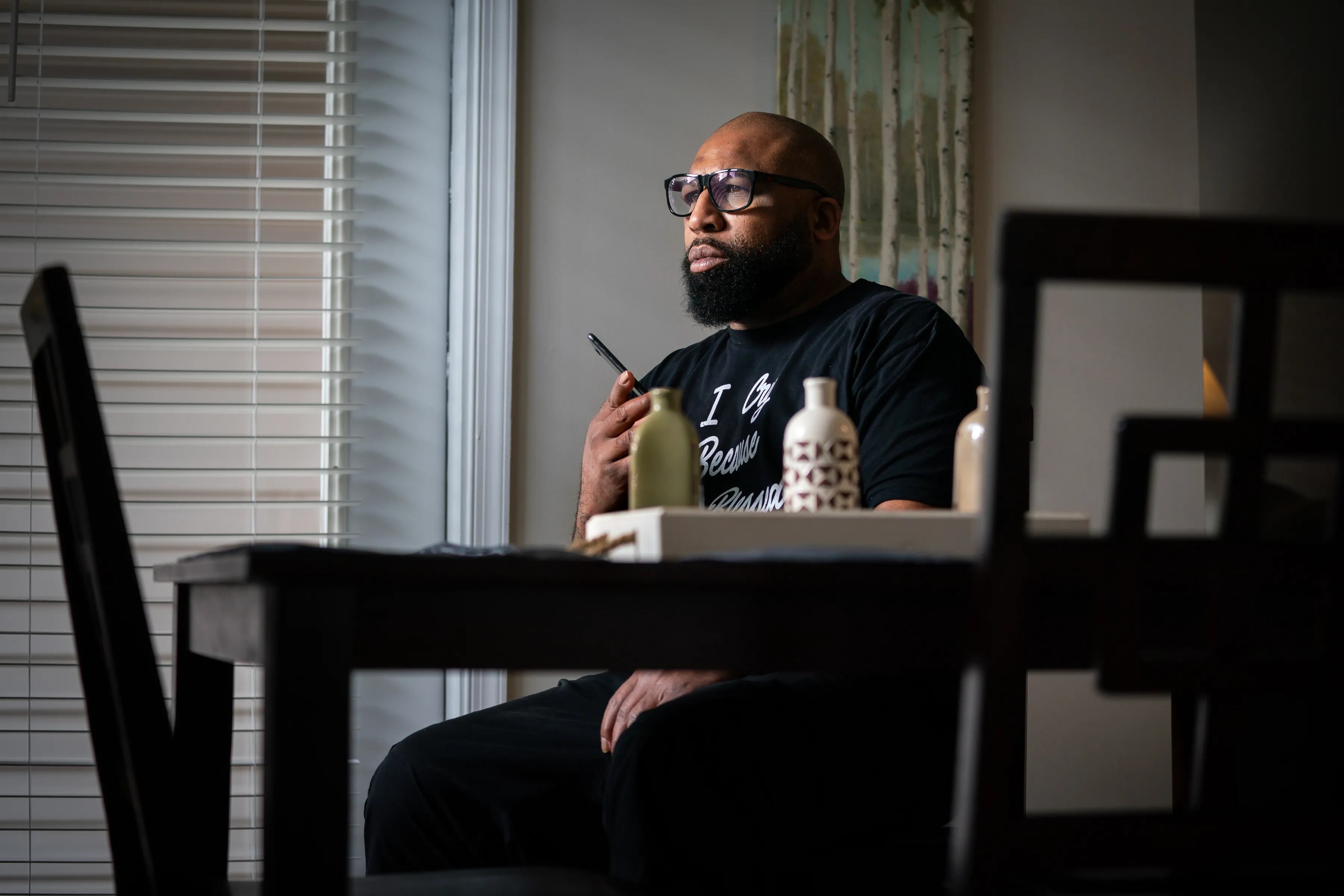 Anthony Wright listens on the phone to the concerns of a prison inmate with stage 4 colon cancer, at his Delaware apartment in April 2021. Wright advocates for inmates.