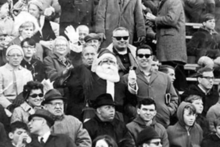 Frank Olivo playing Santa at an Eagles game in 1967. He was pelted with snowballs the next year.