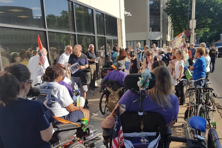 Group of demonstrators outside of the ICE office along Eighth Street near Cherry Street Friday, June 29, 2018.