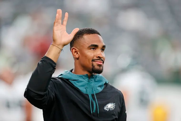 Eagles quarterback Jalen Hurts waves during warm-ups before the Eagles played at the New York Jets in a preseason game on Friday, August 27, 2021.
