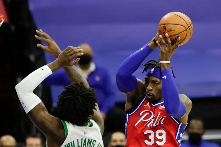 Sixers center Dwight Howard, here grabbing a rebound past Boston Celtics center Robert Williams III, is tied for first in the NBA in rebounds per 36 minutes.