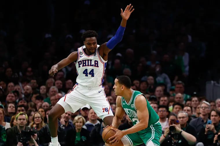 Paul Reed prepares to foul Boston Celtics guard Malcolm Brogdon in the fourth quarter of the Sixers' Game 2 loss in the Eastern Conference semifinals in Boston on May 3.