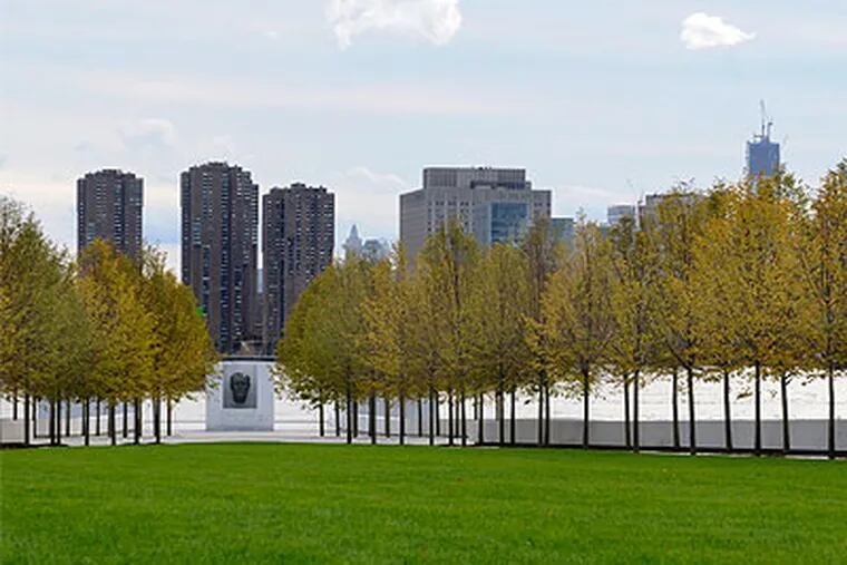 A lawn and flanking trees converge on a bust of Franklin Delano Roosevelt at the new Four Freedoms Park on New York's Roosevelt Island. The park is to be dedicated Wednesday. (Tom Gralish / Staff Photographer)