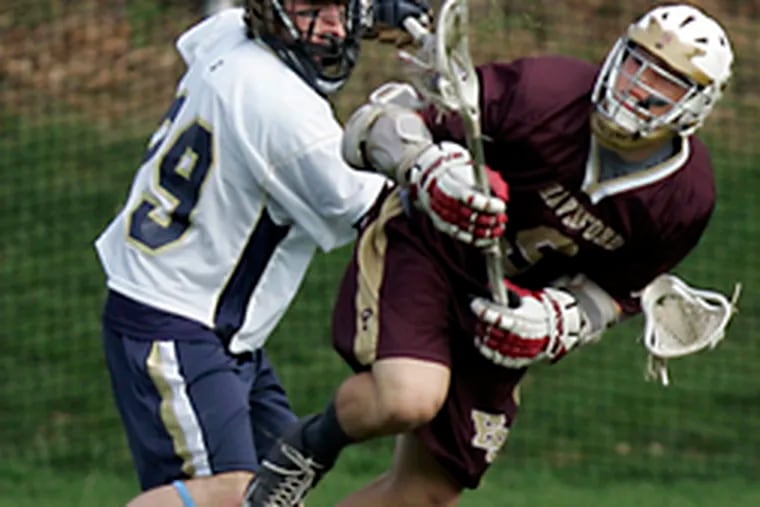 La Salle&#0039;s Robert Saraceni and the Haverford School&#0039;s Craig Owen struggle for possession of the ball in the first period at La Salle. After erupting for a 7-1 lead, the Explorers survived a surge by the Fords that brought the final score to 7-6.