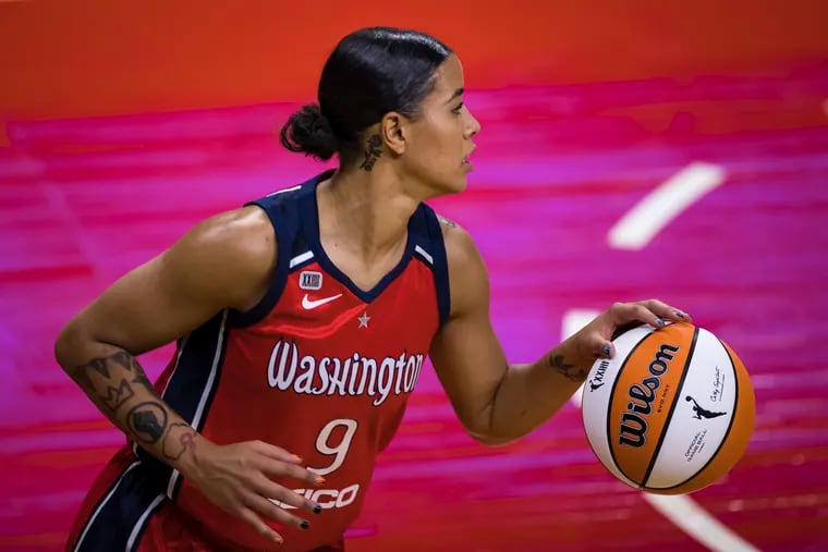 Natasha Cloud of the Washington Mystics dribbles the ball against the Chicago Sky during the first half at Entertainment & Sports Arena on May 15, 2021 in Washington, DC. Photo by Scott Taetsch/Getty Images)