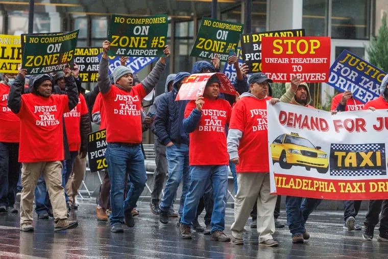 Philadelphia taxi drivers protested around City Hall on Monday. After the Philadelphia International Airport proposed moving taxis out of the Zone 5 pickup area to make room for rideshare services, the airport changed plans to require taxis and rideshare to share the space.