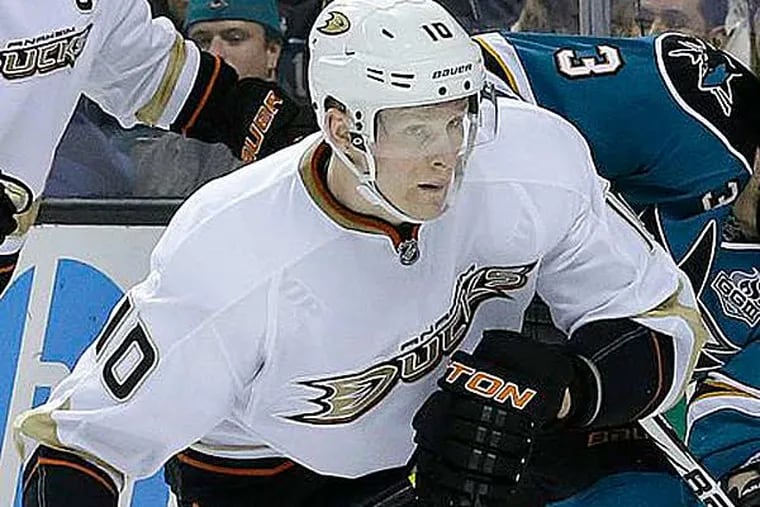 Anaheim Ducks right wing Corey Perry (10) skates toward the puck in
front of San Jose Sharks defenseman Douglas Murray (3), from Sweden,
during the second period of an NHL hockey game in San Jose, Calif.,
Tuesday, Jan. 29, 2013. (Jeff Chiu/AP)