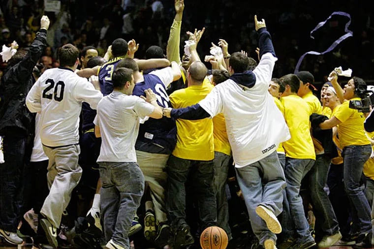 La Salle Fans swarm the crowd after their upset of St. Joe's om 2008. (Ron Cortes/Staff file photo)