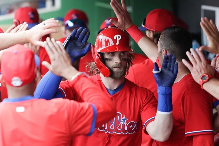 Phillies star Bryce Harper's high-fives will be outlawed as part of MLB's health and safety protocols for playing games during the coronavirus pandemic.