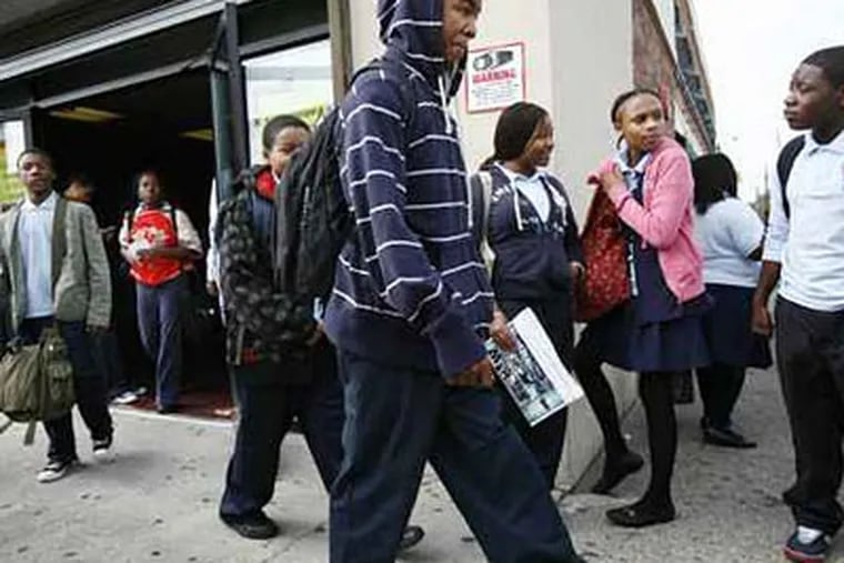 Students leave Germantown Settlement Charter School at the end of the school day. (Eric Mencher/Staff Photographer)