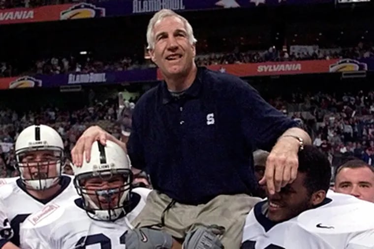 Jerry Sandusky is carried by players after the 1999 Alamo Bowl in San Antonio. At the time, Sandusky was Penn State's defensive coordinator. Gov. Corbett wants to know when the board of the charity Sandusky started knew of allegations. (Eric Gay / Associated Press, file)