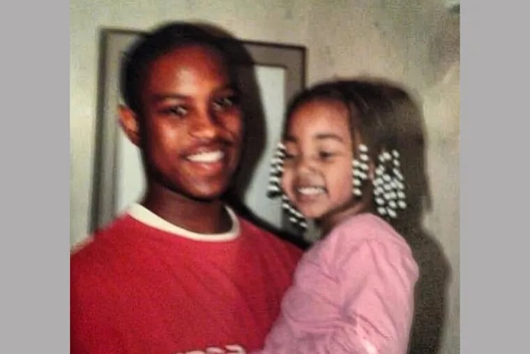 Dwayne Thorpe, holding his daughter in an undated photo, won a new trial after a judge ruled Friday, Nov. 3, that a detective fabricated a witness statement that was used to convict him of first-degree murder in 2009.
