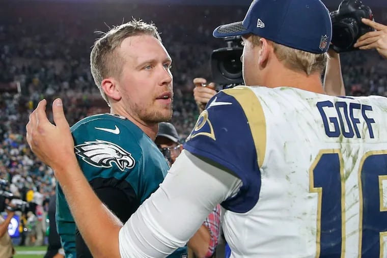 Eagles quarterback Nick Foles meets Los Angeles Rams quarterback Jared Goff after the Eagles 43-35 on Sunday, December 10, 2017.  YONG KIM / Staff Photographer
