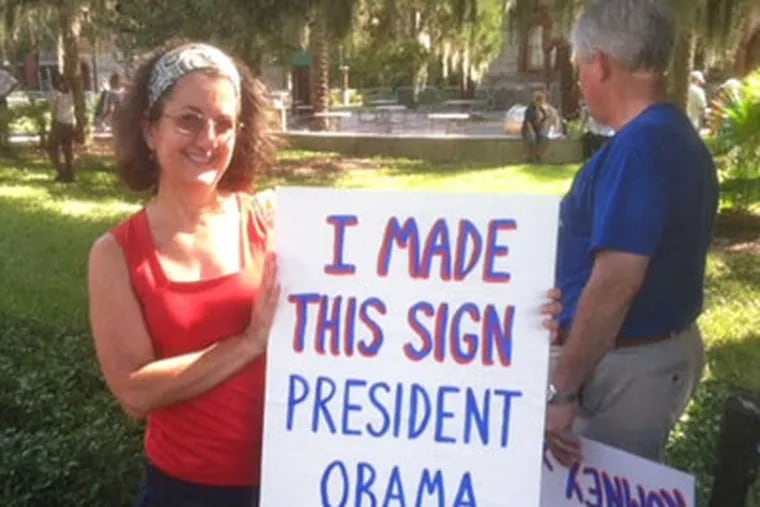 Elisa Miyares at a Romney rally in St. Augustine, Fla. She says Obama's views are "very frightening." (THOMAS FITZGERALD / Staff)