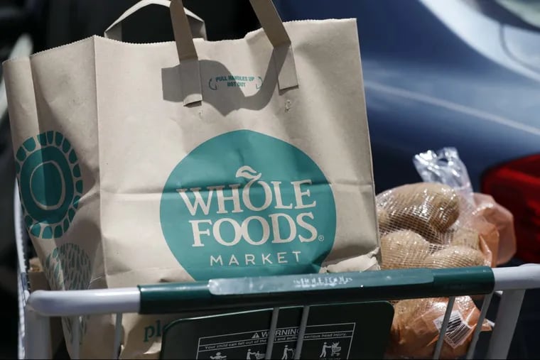 Groceries from Whole Foods Market sit in a cart. Like the AOL Time Warner merger before it, the Amazon-Whole Foods merger may well be transformative, but not necessarily in the ways we expect.