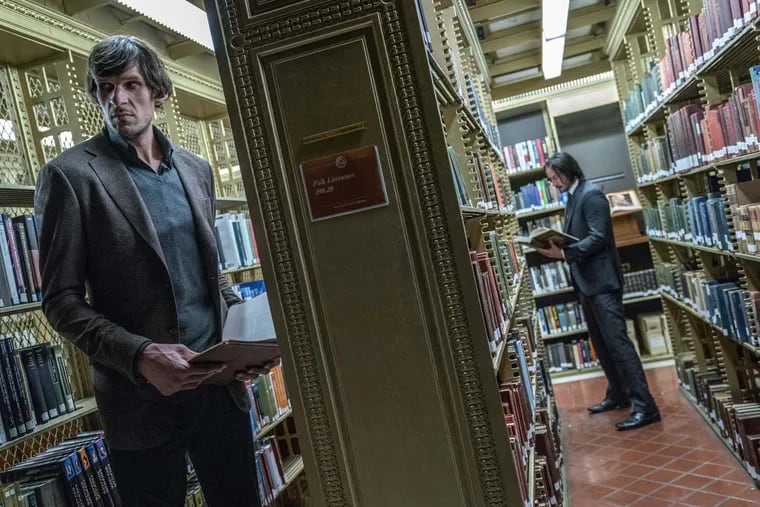 Boban Marjanovic and Keanu Reeves in “John Wick: Chapter 3 — Parabellum.”