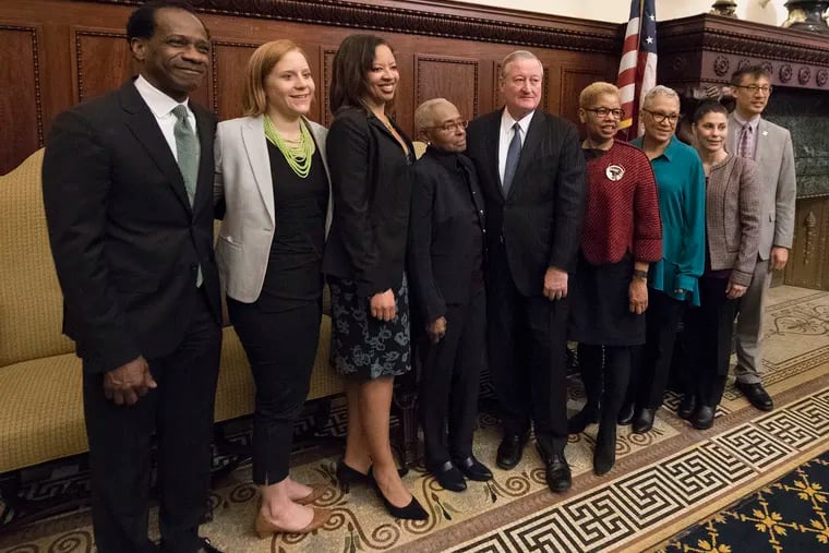 The Philadelphia School Board, whose members were appointed last year by Mayor Jim Kenney (center), will take its first vote Thursday on new charter school applications.
