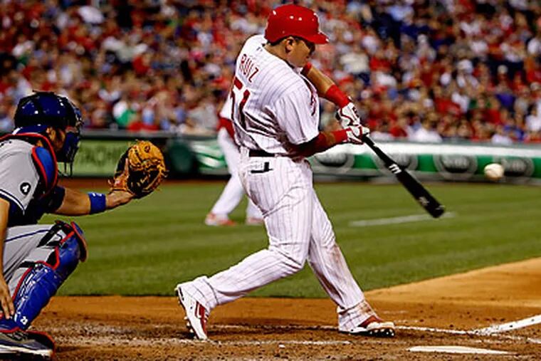 Carlos Ruiz drove in an insurance run with this hit in the eighth inning. (Ron Cortes/Staff Photographer)