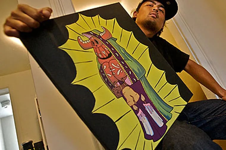 Sticker artist Justin "El Toro" Nagtalon, in South Philly, with his painting "El Toro," a caped mexican boxing bull holding the Liberty Bell. ( John Costello / Staff Photographer )