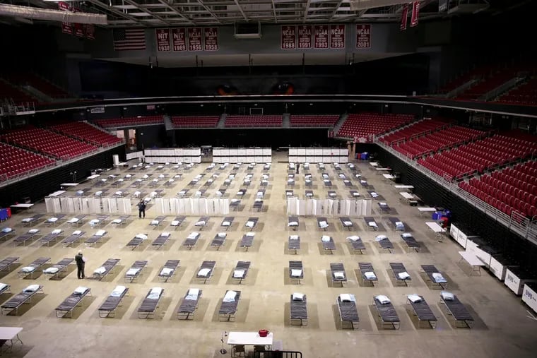 Members of Pennsylvania Task Force 1 transform the Liacouras Center into a federal medical station on the campus of Temple University in Philadelphia.
