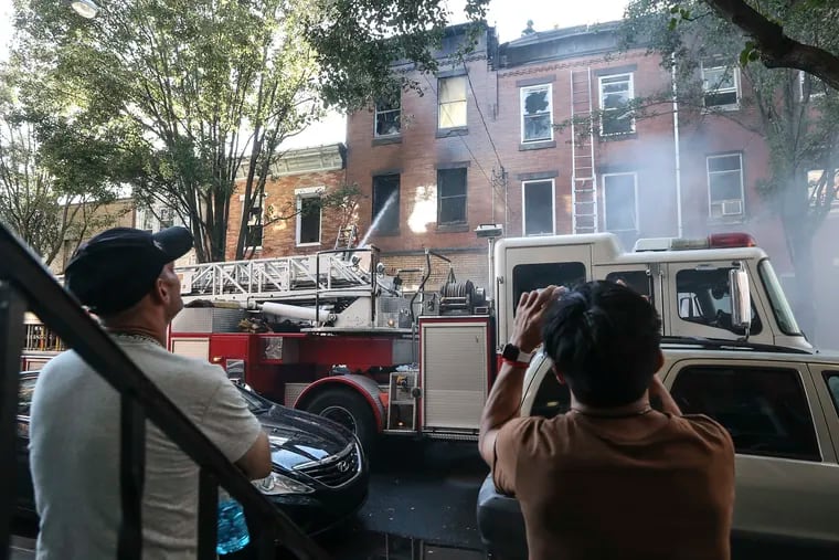 Firefighters battle a two alarm fire 3 row house in the 1600 block of south 5th street Monday, September 20, 2021