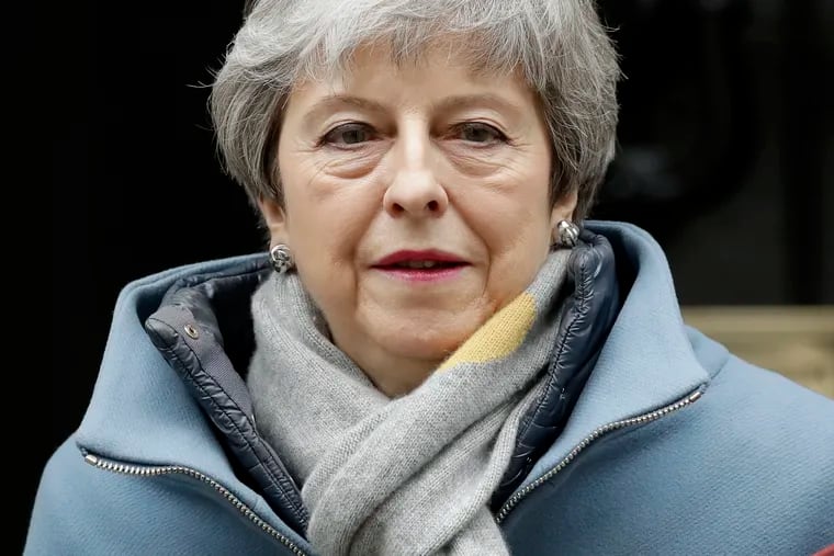 Britain's Prime Minister Theresa May leaves 10 Downing Street to attend the weekly Prime Ministers' Questions session, at parliament in London, Wednesday, March 20, 2019.