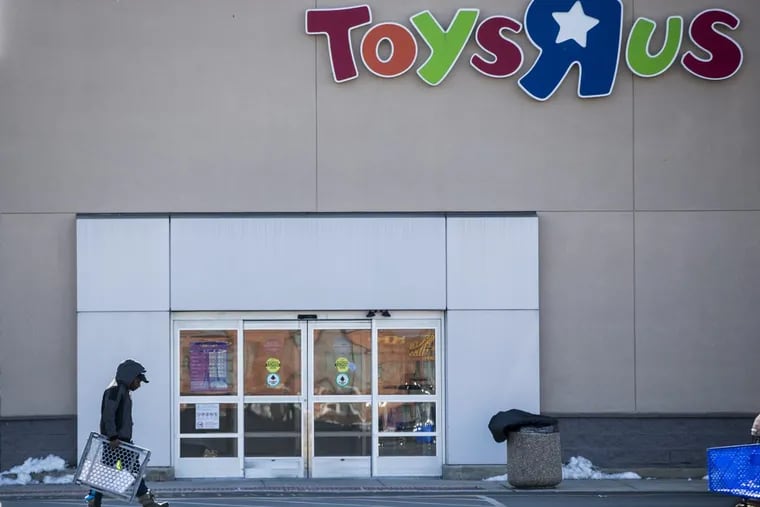 A customer walks out of the Toys R Us store at 3401 Aramingo Avenue.