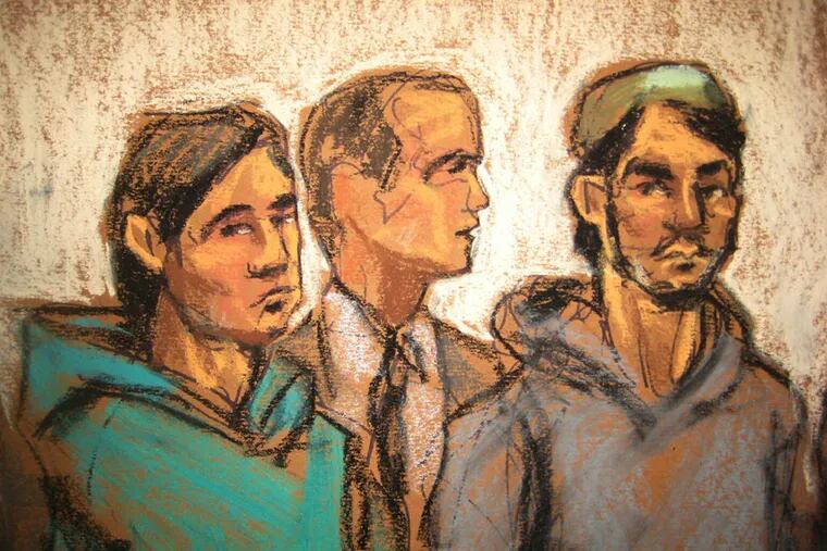 In this courtroom drawing, defendant Akhror Saidakmetov, left; an interpreter, center; and defendant Abdurasul Hasanovich Juraboev appear at federal court in New York on terrorism charges Wednesday, Feb. 25, 2015. (Jane Rosenberg/AP Photo)
