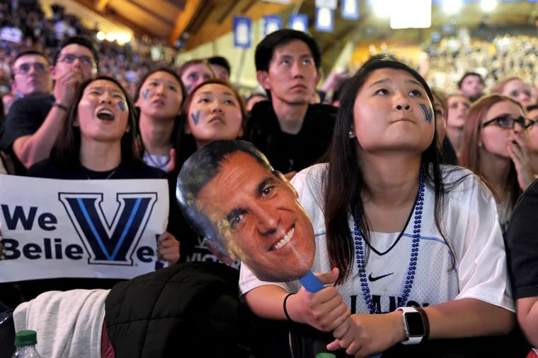 Villanova students  and a coach Jay Wright mask watch during the dramatic final minutes of the NCAA championship game in 2016.