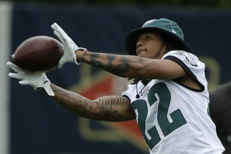 Eagles rookie cornerback Sidney Jones catches a pass during training camp on Monday.